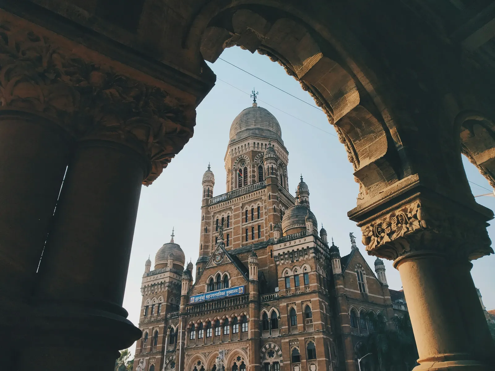 A view of the BMC tower framed by an arch