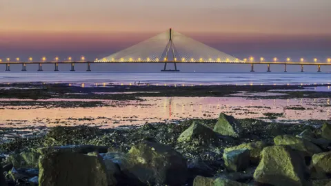 The Sea Link beyond the rocky Mumbai shoreline